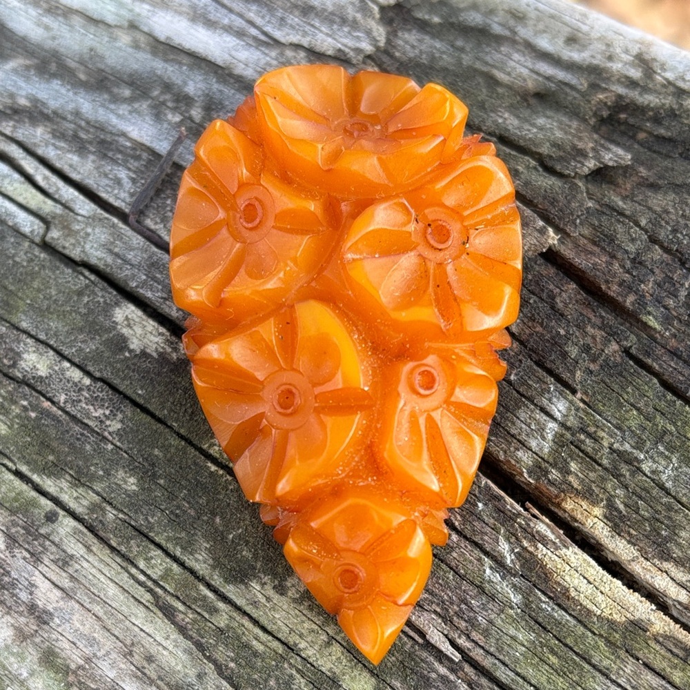 Sweet floral tangerine Bakelite dress clip